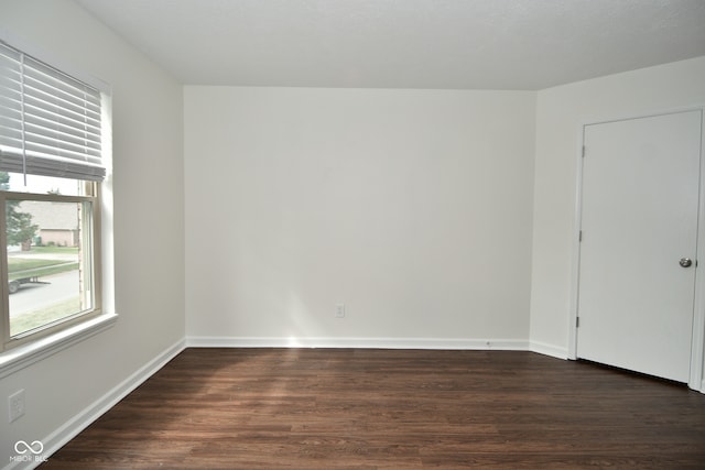 empty room featuring dark hardwood / wood-style floors