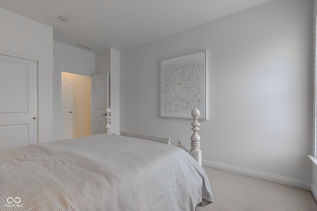 bedroom featuring light colored carpet