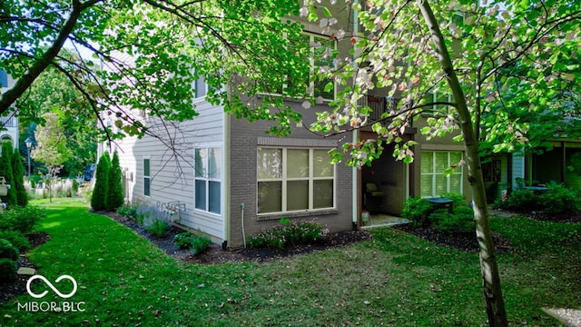 view of property exterior with a yard