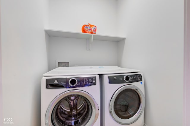 laundry room featuring washing machine and dryer