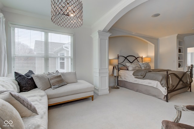 bedroom with carpet, ornate columns, and crown molding