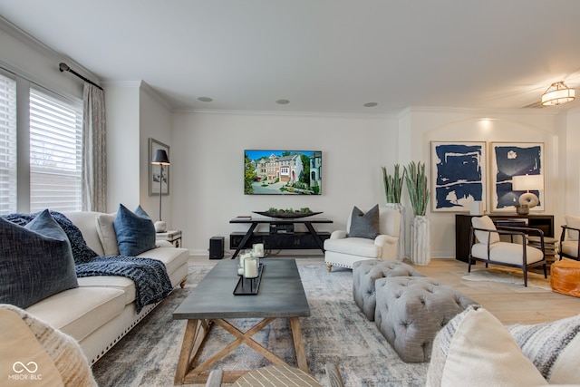 living room featuring wood-type flooring and crown molding