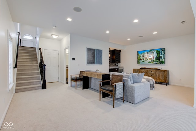 living room featuring light colored carpet