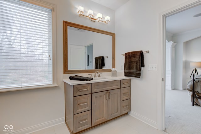 bathroom with crown molding and vanity