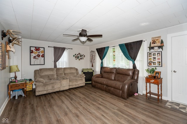 living room with wood-type flooring and ceiling fan