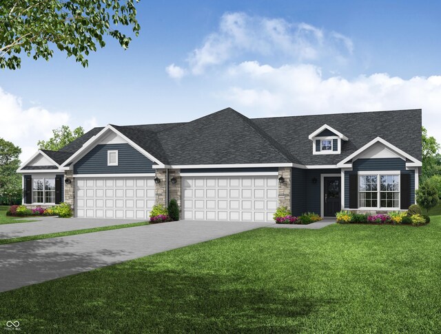 view of front of home featuring a garage and a front lawn