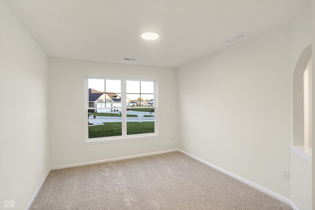 unfurnished room featuring carpet