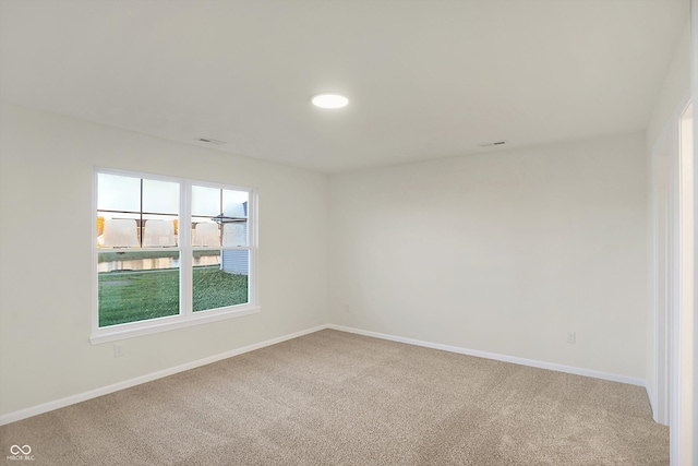 empty room with carpet flooring