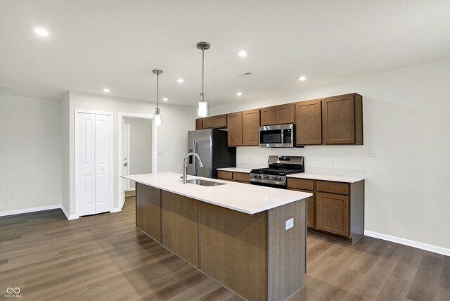 134 Maxim Ct, Cumberland, IN 46229 - kitchen featuring appliances with stainless steel finishes, a sink, baseboards, recessed lighting, and dark wood finished floors