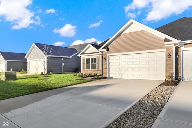 view of front of house featuring a front lawn and a garage