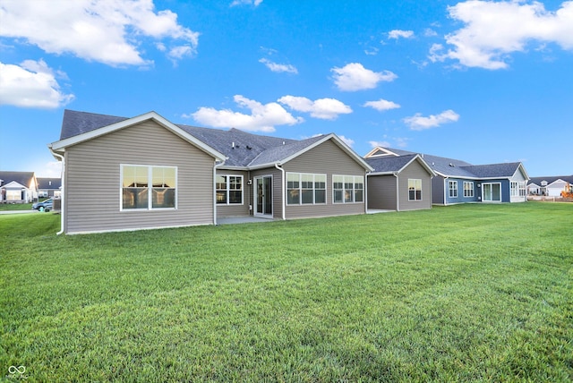 134 Maxim Ct, Cumberland, IN 46229 - rear view of house featuring a yard