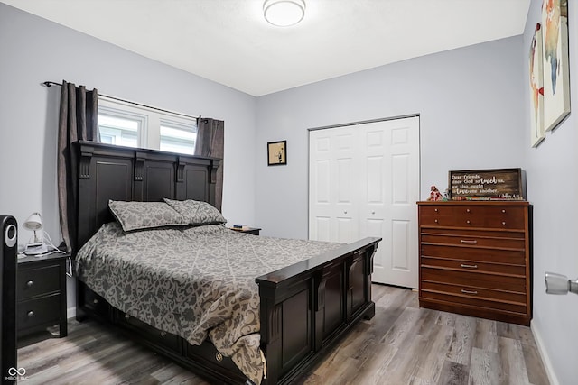 bedroom featuring a closet and light hardwood / wood-style floors