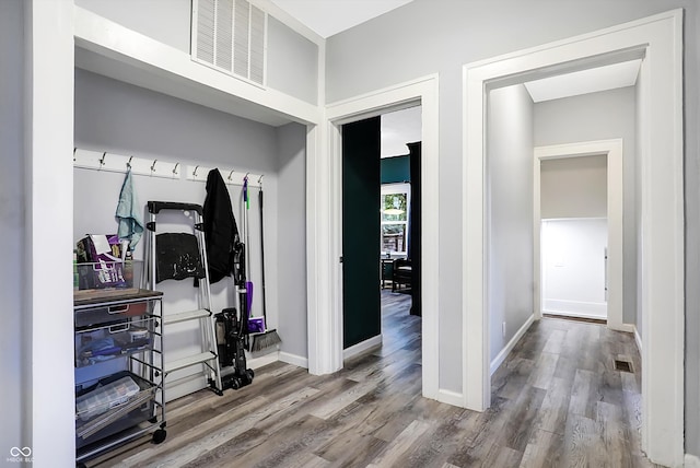 mudroom with light hardwood / wood-style floors