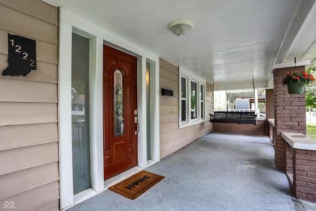 property entrance with a porch