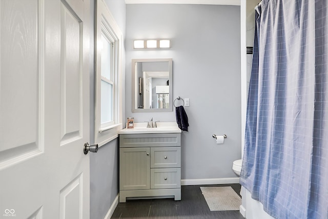 bathroom featuring vanity and toilet