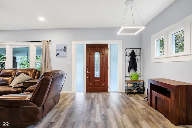 foyer entrance with light hardwood / wood-style floors