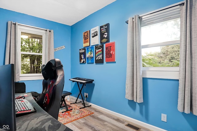 office with hardwood / wood-style flooring