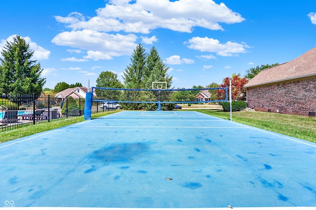 view of community with volleyball court and fence