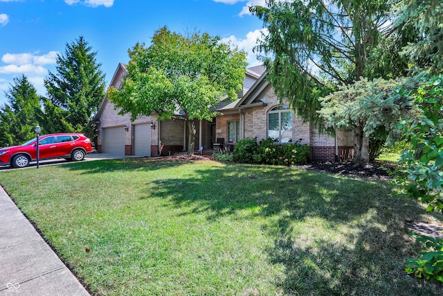 view of front of home with a garage and a front yard