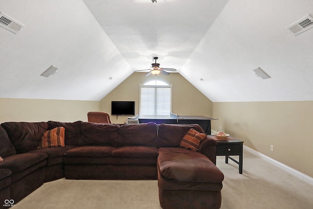 living area with lofted ceiling, baseboards, visible vents, and light colored carpet