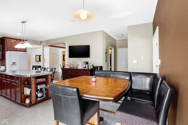 dining area featuring light tile patterned flooring