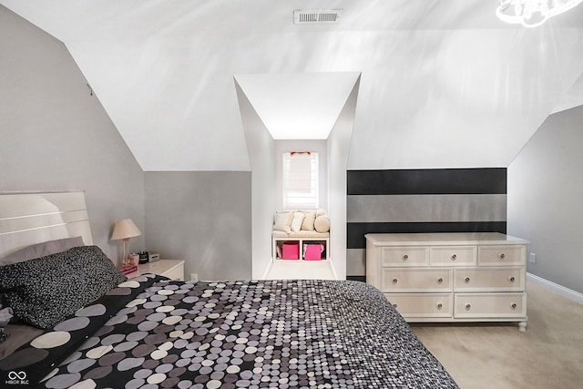 bedroom featuring light carpet, visible vents, and vaulted ceiling