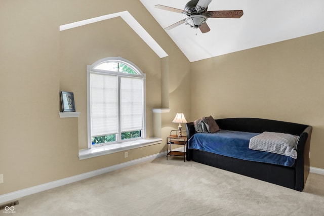 bedroom with high vaulted ceiling, ceiling fan, and light colored carpet