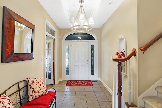 foyer entrance featuring an inviting chandelier and light tile patterned floors