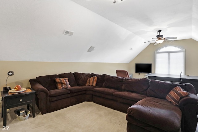 carpeted living area featuring a ceiling fan, lofted ceiling, and visible vents