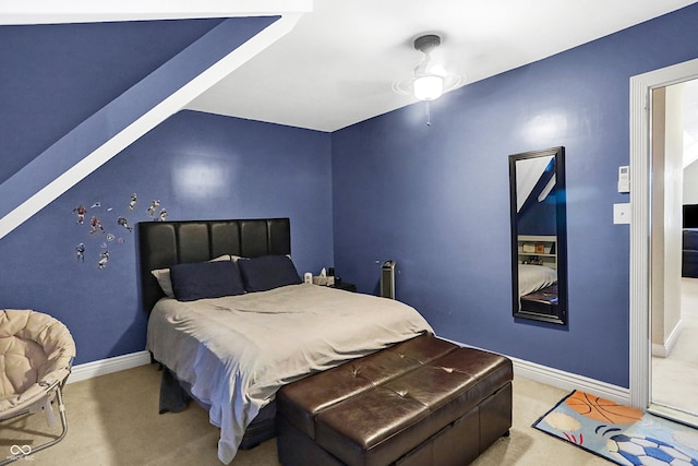 bedroom featuring ceiling fan and light colored carpet