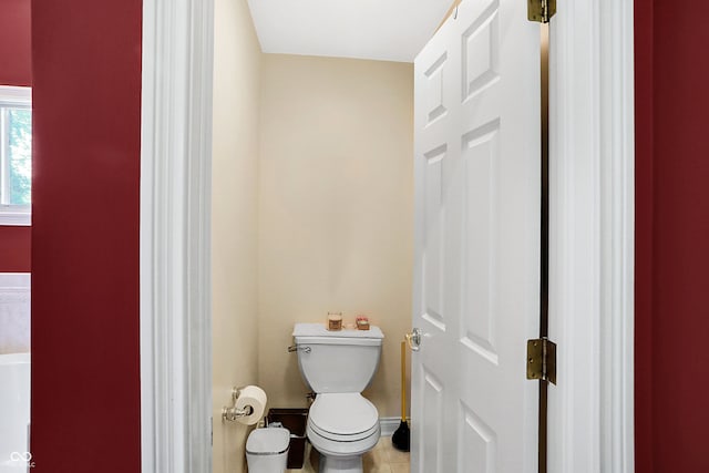 bathroom featuring toilet and tile patterned floors