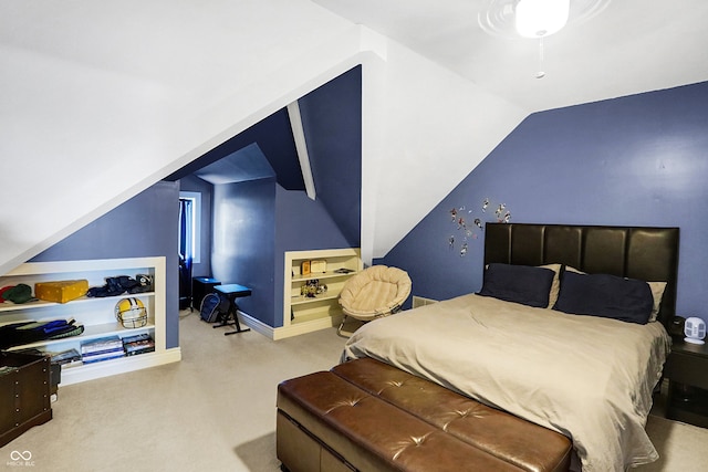 carpeted bedroom featuring lofted ceiling