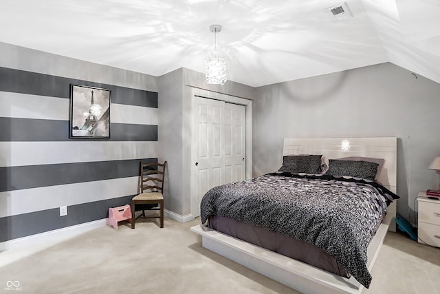 bedroom with light colored carpet and a closet