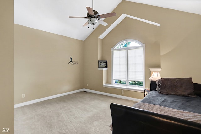 bedroom with ceiling fan, light carpet, and multiple windows