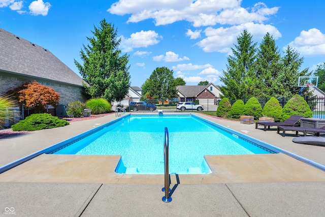 view of swimming pool with a fenced in pool, a patio area, and fence