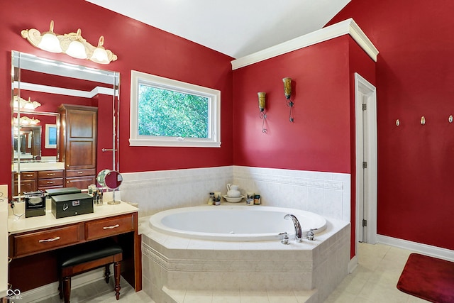 bathroom with tile patterned floors, tiled bath, and vanity