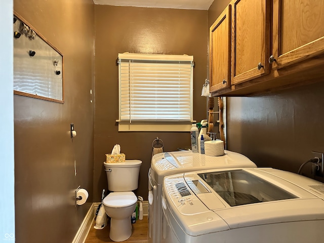 interior space with hardwood / wood-style floors and washing machine and clothes dryer