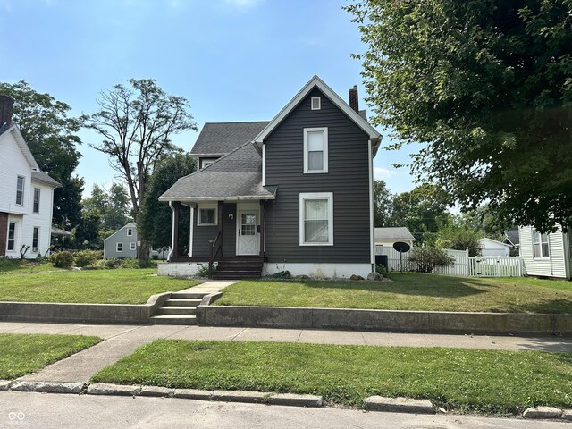 view of property featuring a front yard