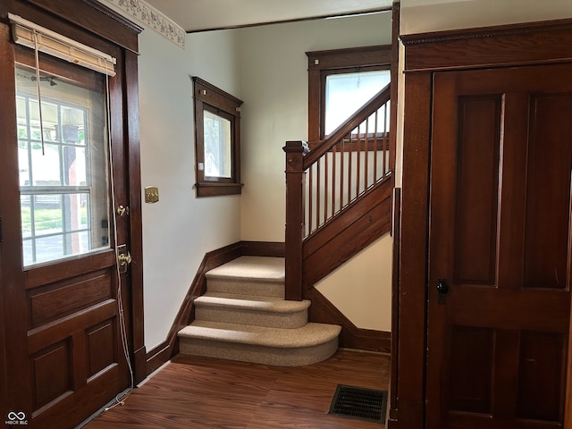 interior space featuring a wealth of natural light and hardwood / wood-style floors