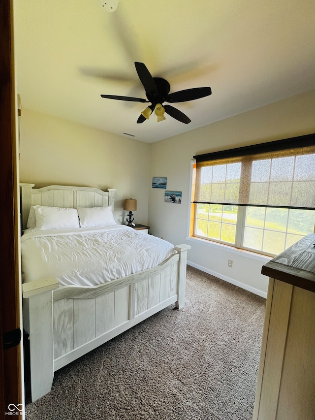 carpeted bedroom featuring ceiling fan