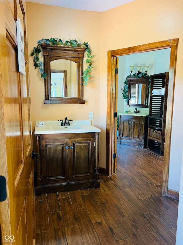 bathroom with hardwood / wood-style flooring and vanity