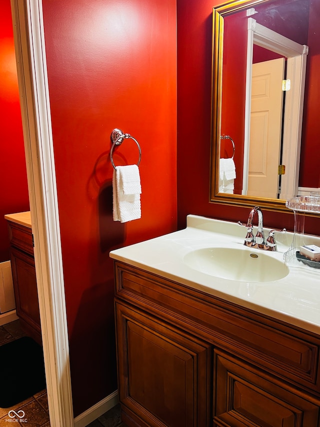 bathroom featuring tile patterned flooring and vanity