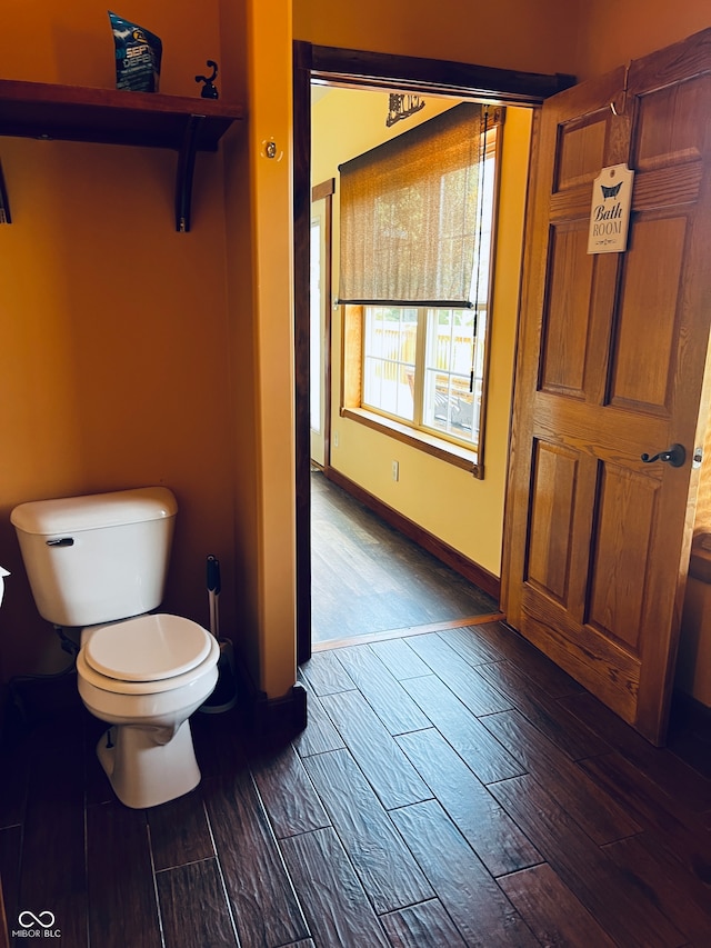 bathroom featuring toilet and hardwood / wood-style floors