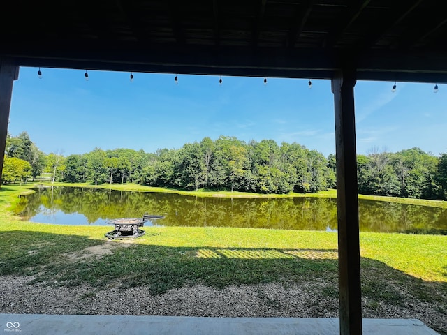 exterior space with a lawn and a water view