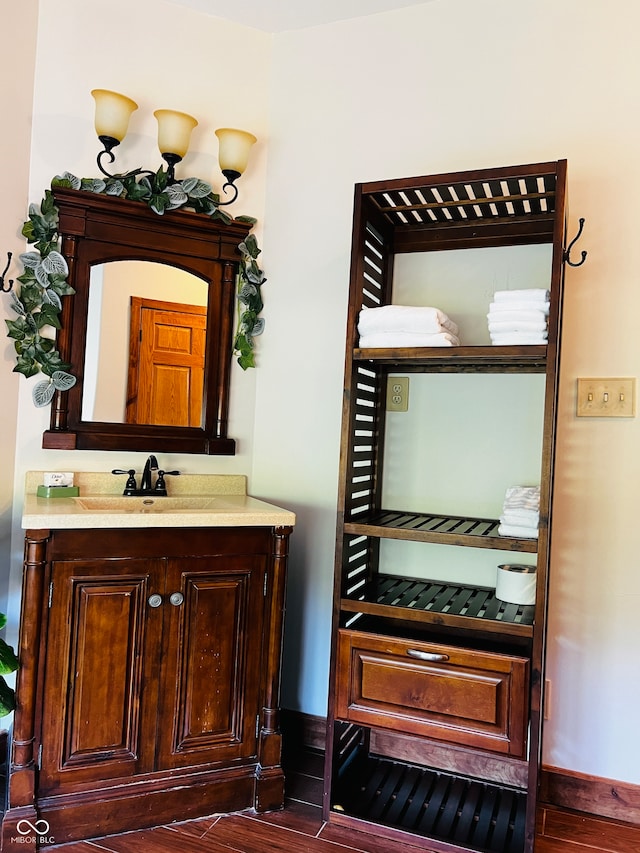 bathroom with vanity and wood-type flooring