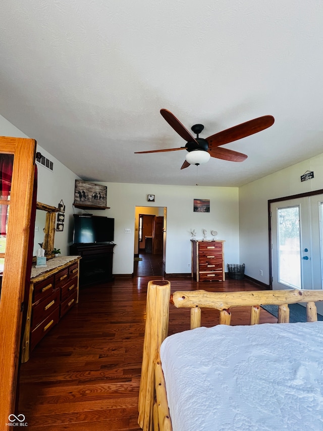 bedroom with dark wood-type flooring and ceiling fan