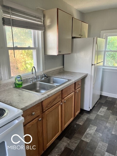 kitchen with white refrigerator and sink