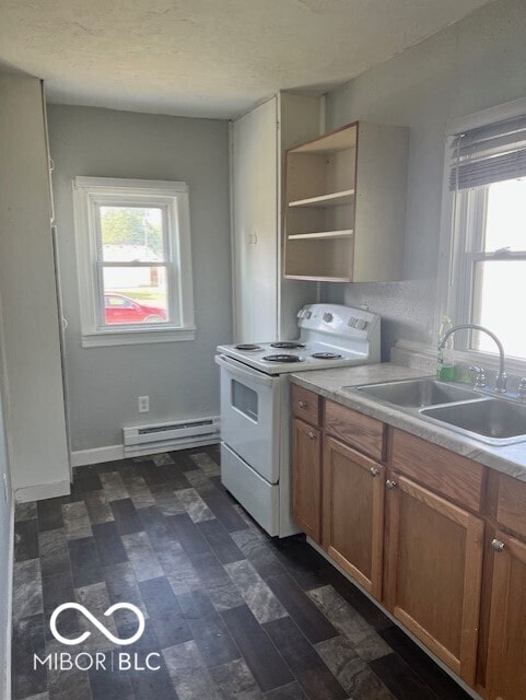 kitchen with a baseboard radiator, white range with electric stovetop, a textured ceiling, and sink