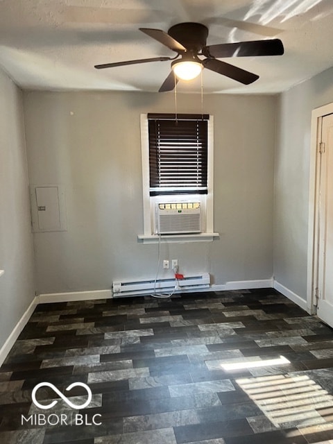 unfurnished room featuring a baseboard heating unit, cooling unit, ceiling fan, and electric panel