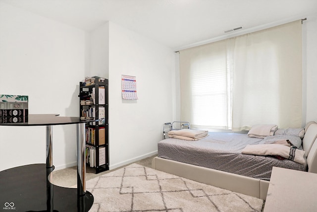 bedroom with light carpet